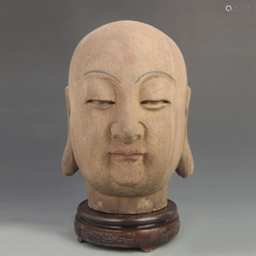 A FINE WOODEN BUDDHA HEAD