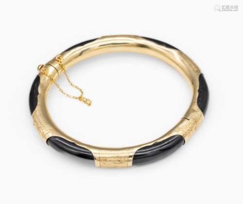 14 kt gold bangle with ebony inlay