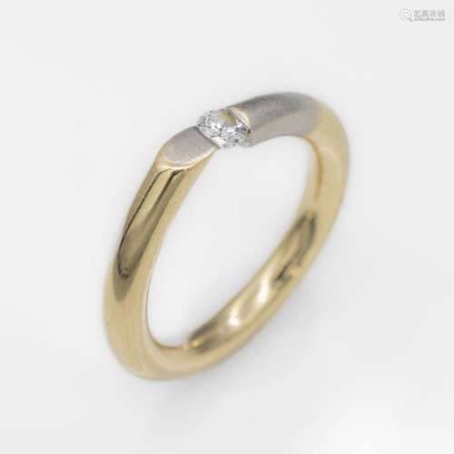 14 kt gold tension ring with brilliant