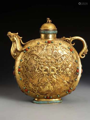 In the Qing Dynasty, a bronze gilded flat pot with a phoenix...