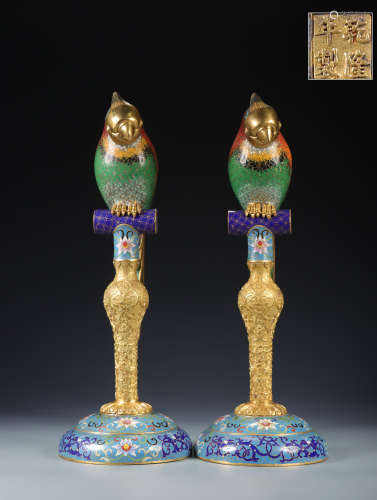 A pair of gold-plated silk enamel parrot ornaments with copp...