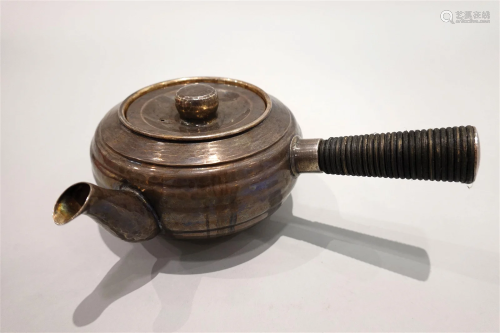 A silver Kyusu teapot.