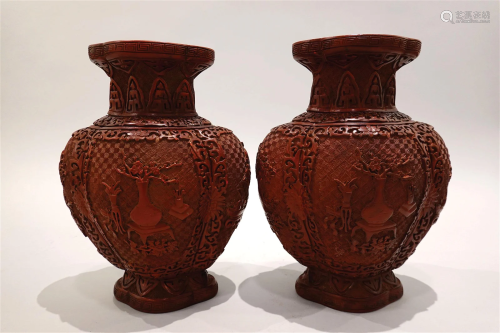 Pair of red lacquer vases with carving. QianLong four-charac...