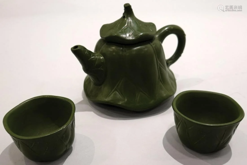 A set of 3 YiXing teapot with lotus leaf design.