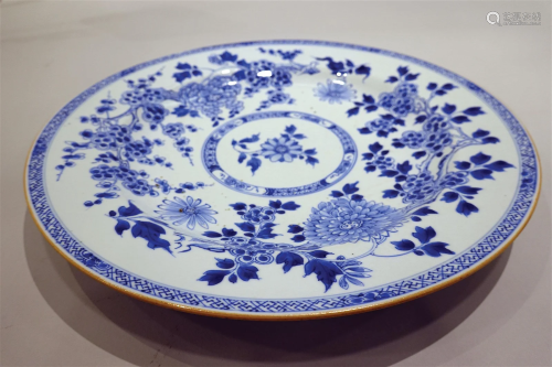 A large blue and white plum bossom plate with gilted rim.
