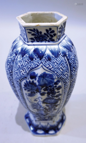 A blue and white hexagonal vase with landscape pattern. Mid-...