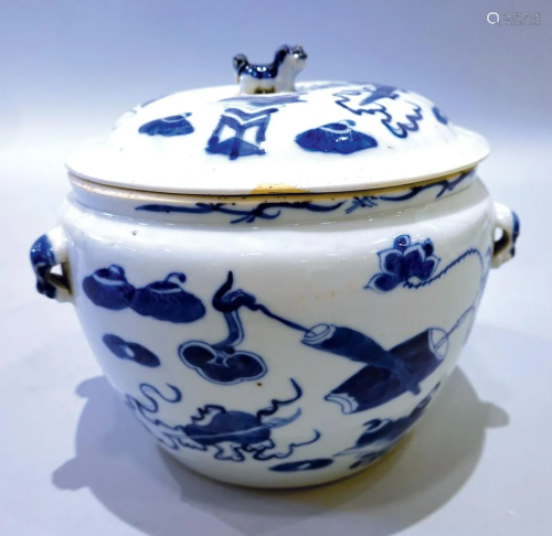 A blue and white pot with landscape pattern as well as cover...
