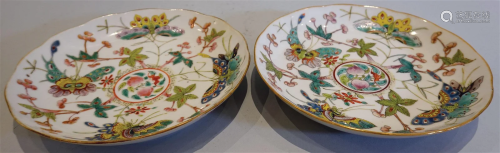 Pair of plates with famille roses and butterflies pattern. Q...