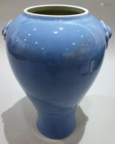 A sky-blue glazed vase with handles design. QianLong six-cha...