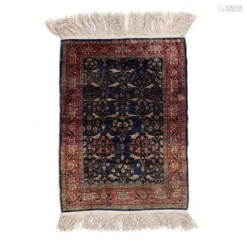 A SMALL ORIENTAL CARPET