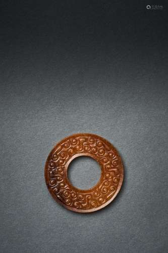 A SMALL MOTTLED RUSSET JADE BI, HAN DYNASTY (206BC-220AD)