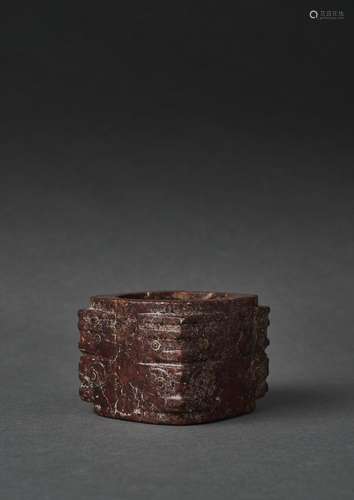 A MOTTLED RED JADE TWO-TIERS CONG, POSSIBLY NEOLITHIC PERIOD...