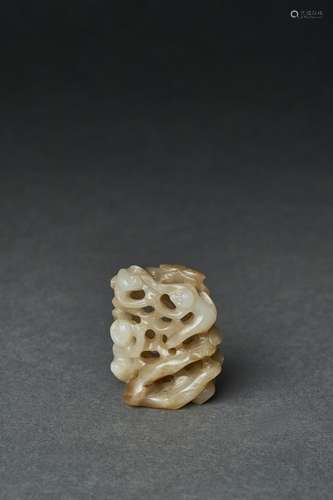 A PALE WHITE JADE OPENWORK FINIAL, YUAN DYNASTY (1279-1368)