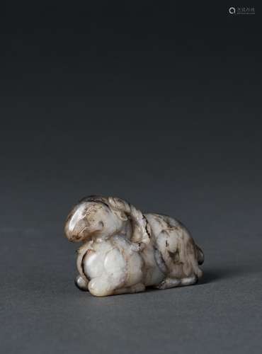 A STRIATED PALE GREY JADE CARVING OF A RECUMBENT RAM, SONG D...