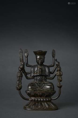 A RARE BRONZE SEATED BUDDHA WITH ATTENDANTS, MING DYNASTY (1...