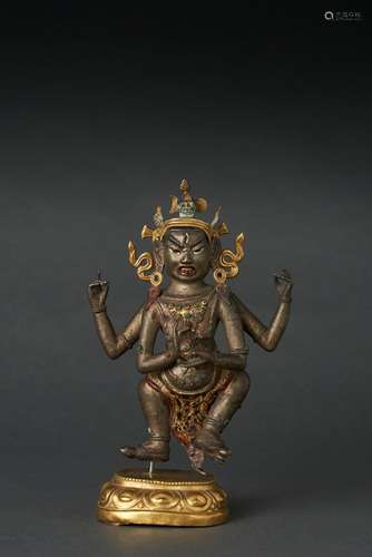 A TIBETAN PARCEL-GILT BRONZE STANDING FIGURE OF MAHAKALA, 18...