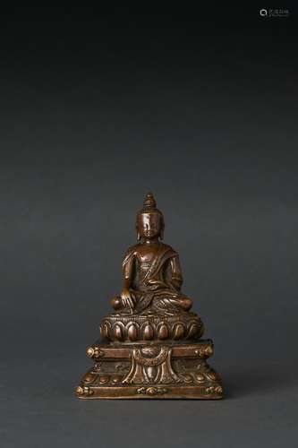 A TIBETAN BRONZE SEATED FIGURE OF SHAKYAMUNI, 16TH/17TH CENT...