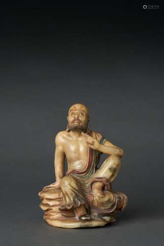 A SOAPSTONE FIGURE OF A LUOHAN, QING DYNASTY (1644-1912)