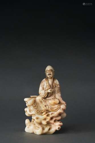 A SOAPSTONE FIGURE OF A LUOHAN, QING DYNASTY (1644-1912)