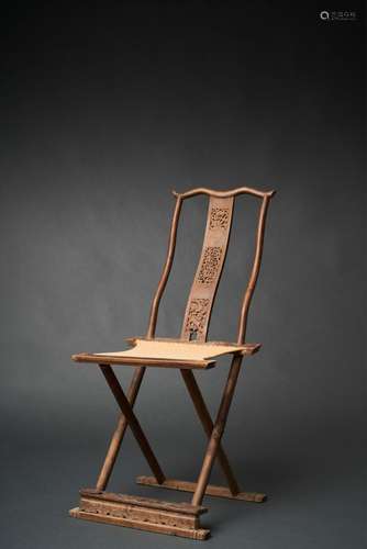 A CARVED WOOD FOLDING YOKE-BACK SIDE CHAIR JIAOYI, QING DYNA...