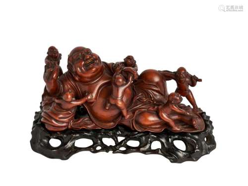 A BOXWOOD CARVING OF A MONK BUDAI WITH BOYS, LATE QING DYNAS...