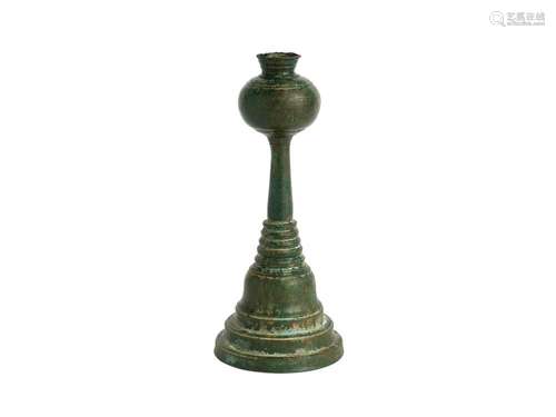 A KHMER BRONZE CANDLE STICK, PROBABLY 12TH CENTURY