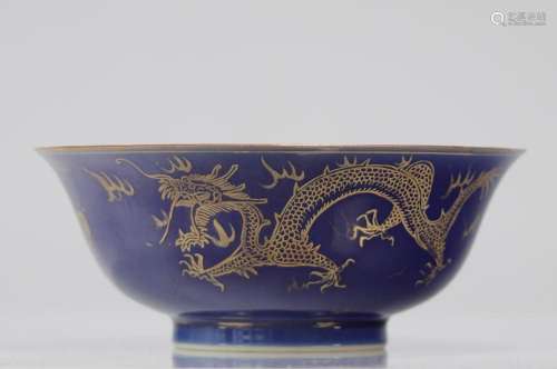 Large blue and gold powdered porcelain bowl decorated with a...