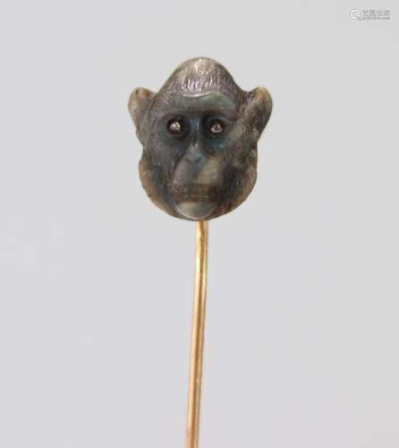 Gold Faberge pin surmounted by a monkey's head