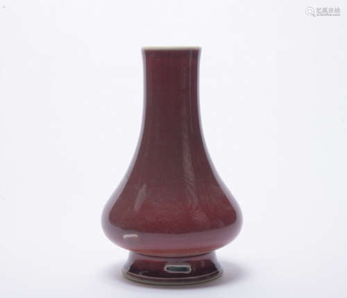 A red-glazed vase