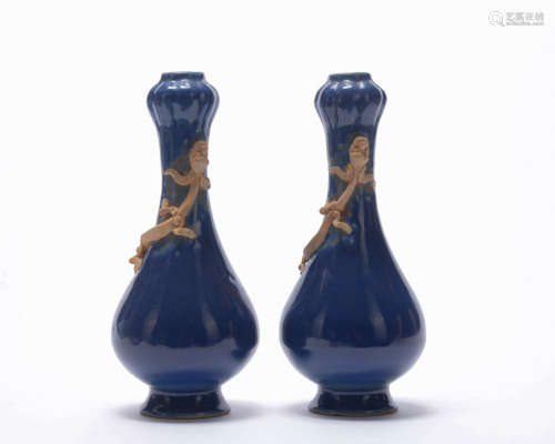 A pair of blue glazed garlic-head vase