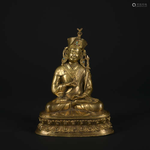 A gilt-bronze statue of Padmapani