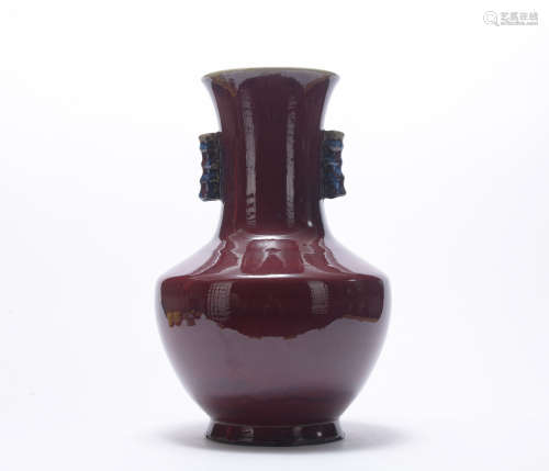A red-glazed vase