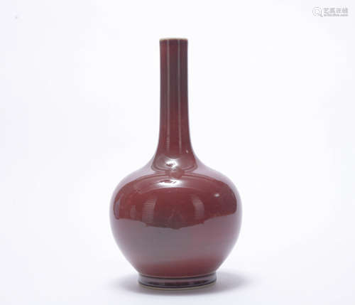 A red-glazed vase