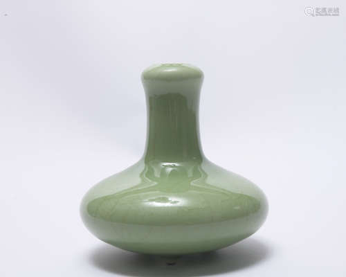 A green glazed vase