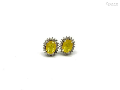 Oval Cut Yellow Sapphire Stud Earrings Surrounded in Swarovs...