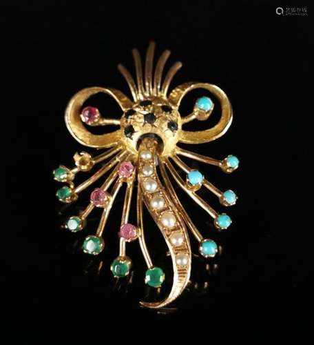 Broche en or jaune ornée de pierres et demi-perles. H_5 cm.P...