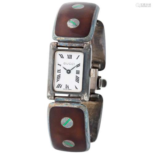 GUCCI. FINE AND CHARMING, LADY’S RECTANGULAR SHAPED WRISTWAT...