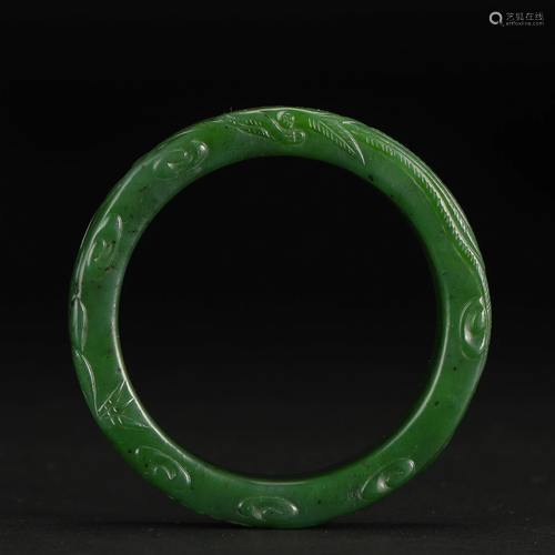 A Chinese Carved Spinach Green Jade Bangle Qing Dyn.