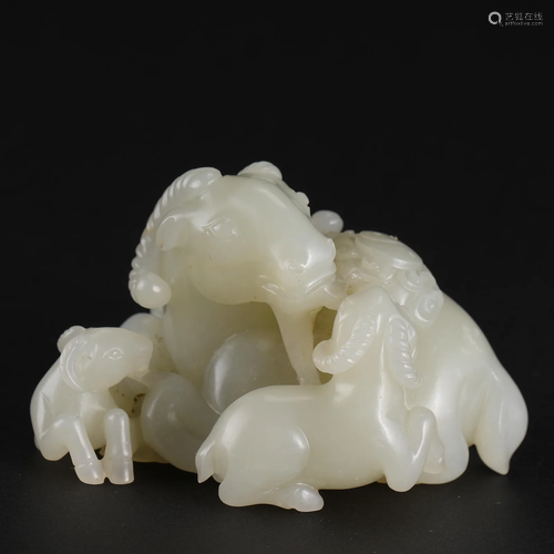 A Chinese Carved White Jade Rams Group Qing Dyn.