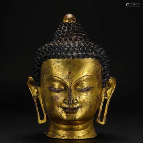 A Tibetan Bronze-gilt Buddha Head