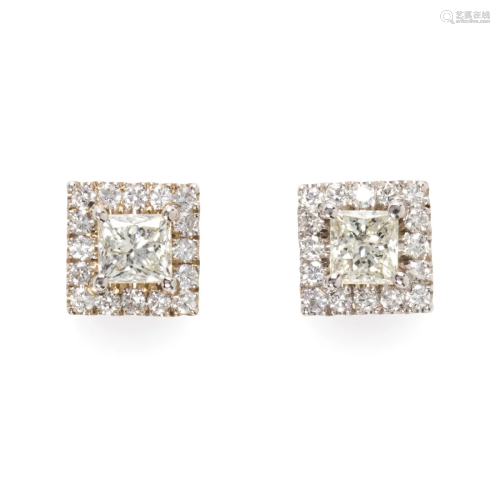A pair of diamond and eighteen karat white gold stud earring...