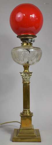 A Victorian Brass Oil Lamp, The Support in the Form of a Rib...