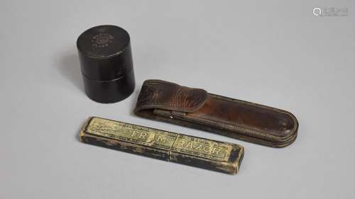 An Early 20th Century Leather Case Containing Two Cut Throat...