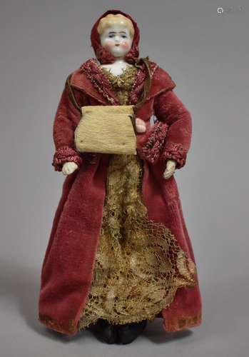 A Small Victorian Porcelain Head Doll with Original Velvet a...