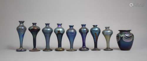 A Collection of Nine Pieces of Iridescent Purple Swirl Glass...