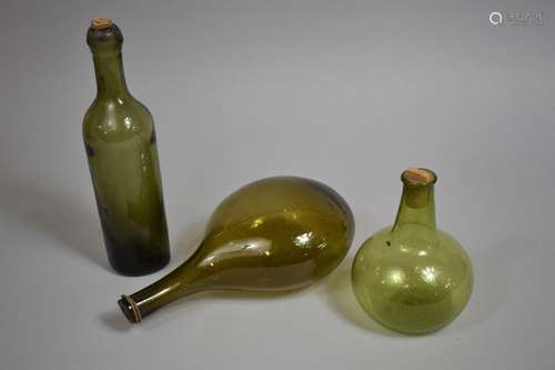 Three 19th Century Free Blown Coloured Glass Bottles, The La...