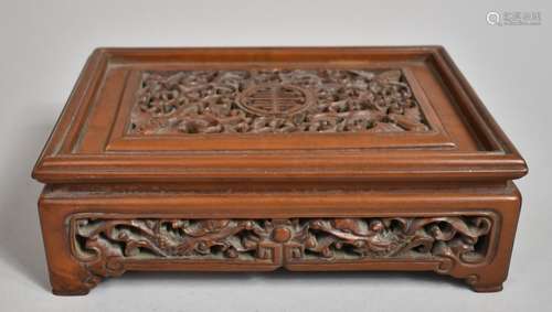 A Chinese Cherry Wood Pierced and Carved Rectangular Stand d...