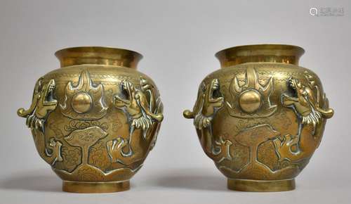 A Pair of Chinese Bronze Vases decorated in Relief with Drag...