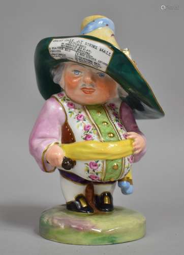 A Royal Crown Derby Mansion House Dwarf Wearing Floral Waist...