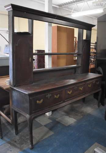 A 19th Century Oak Three Drawer Dresser on Cabriole Front Su...